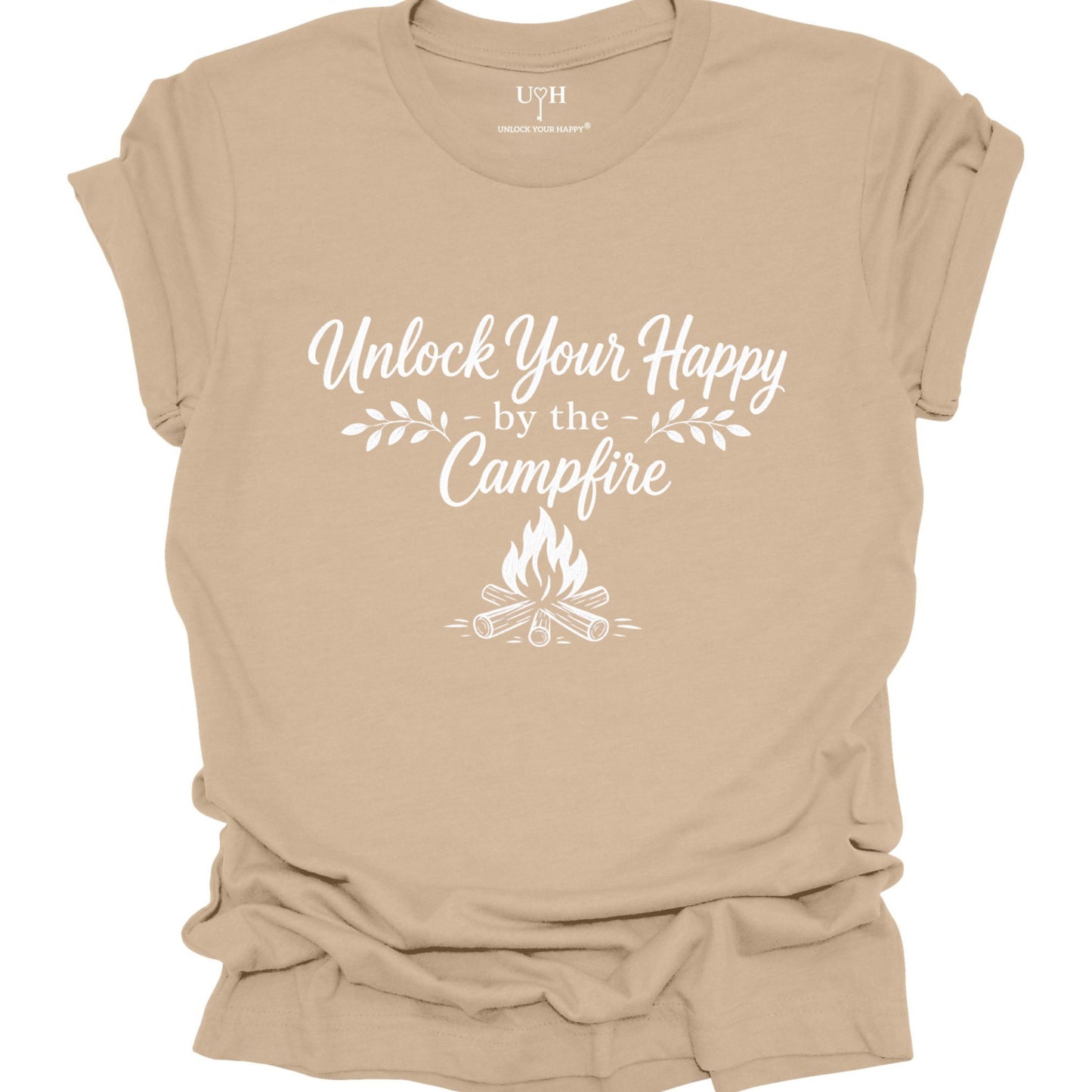 Tan t-shirt with 'Unlock Your Happy by the Campfire' text and graphic on a white background