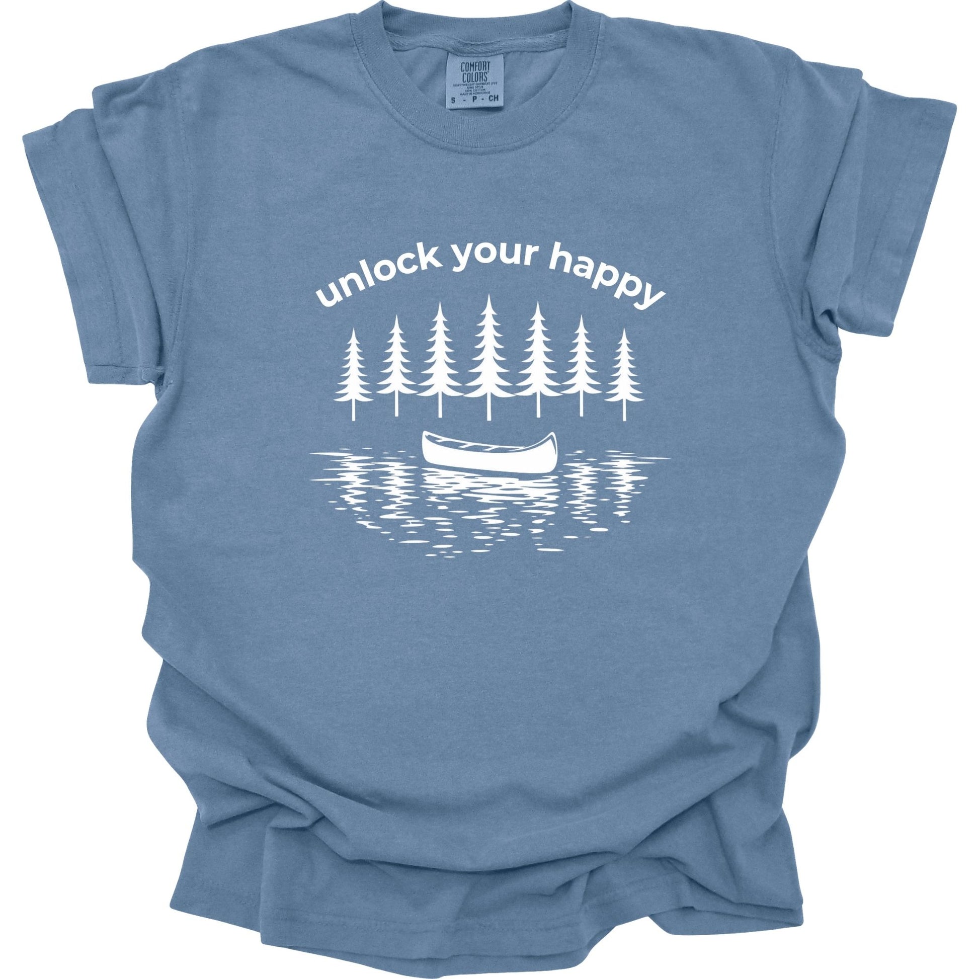 Blue t-shirt with white graphic of trees and a canoe with 'unlock your happy' text on a white background