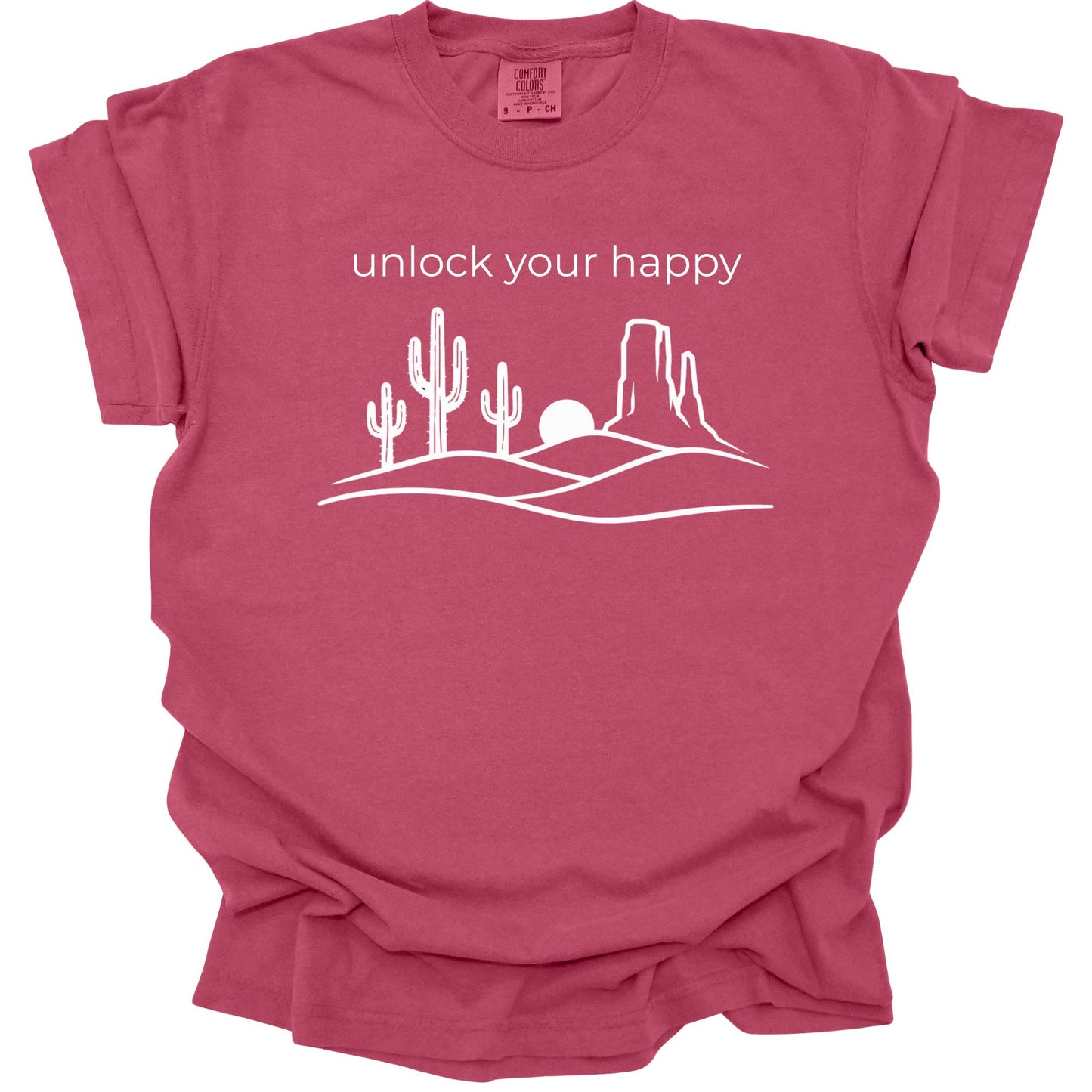 Brick t-shirt with desert graphic and 'unlock your happy' text on a white background