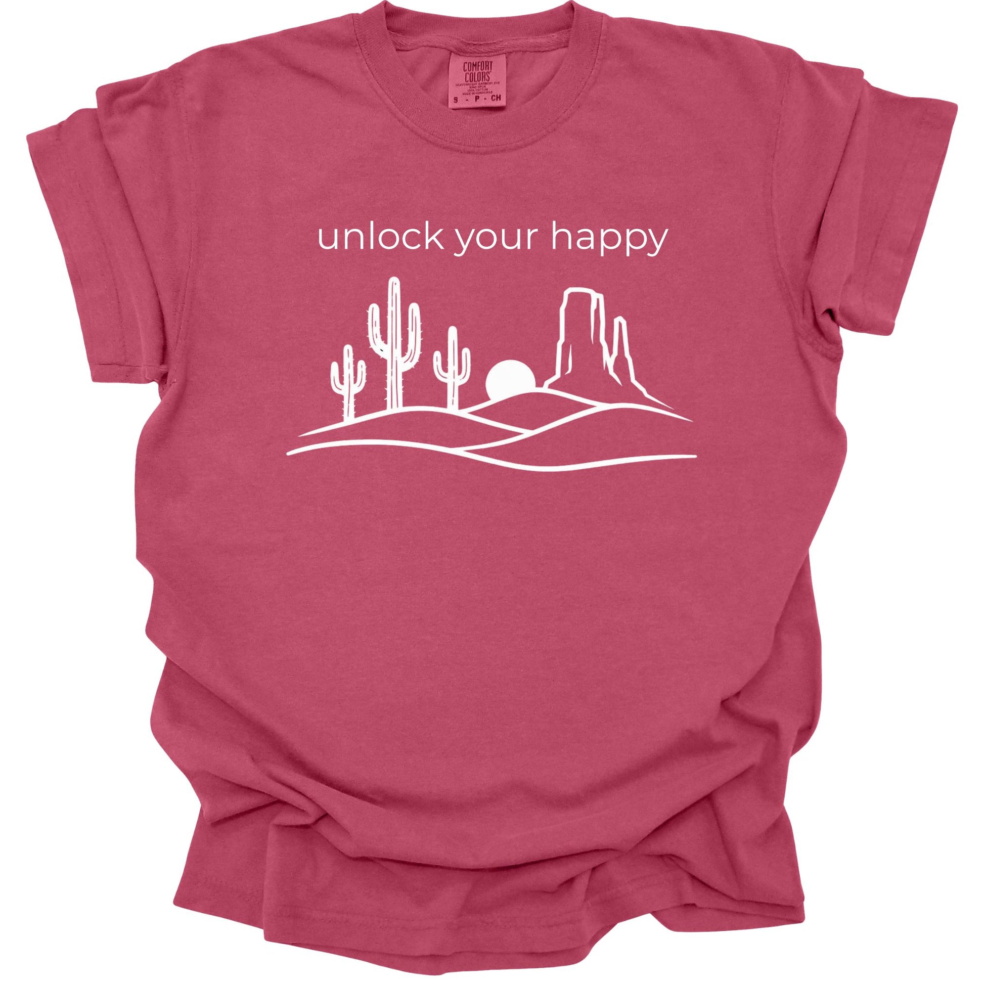 Brick t-shirt with desert graphic and 'unlock your happy' text on a white background