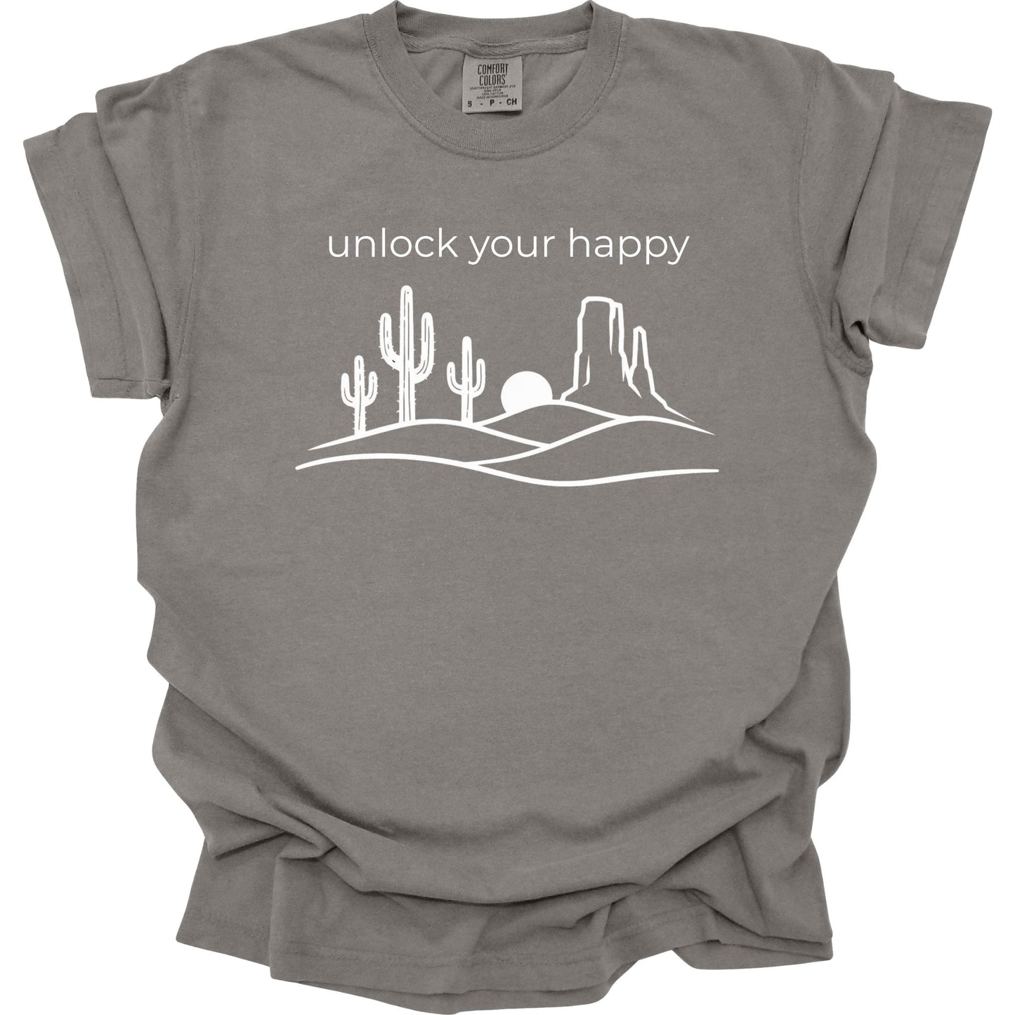 Grey t-shirt with desert graphic and 'unlock your happy' text on a white background