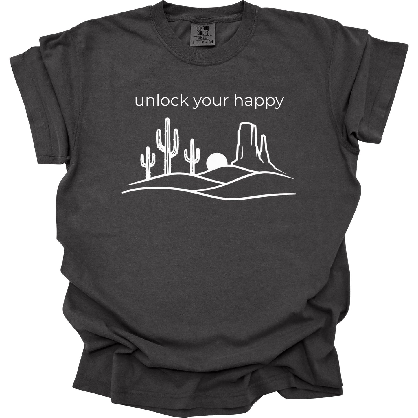 Pepper colored  t-shirt with desert graphic and 'unlock your happy' text on a white background