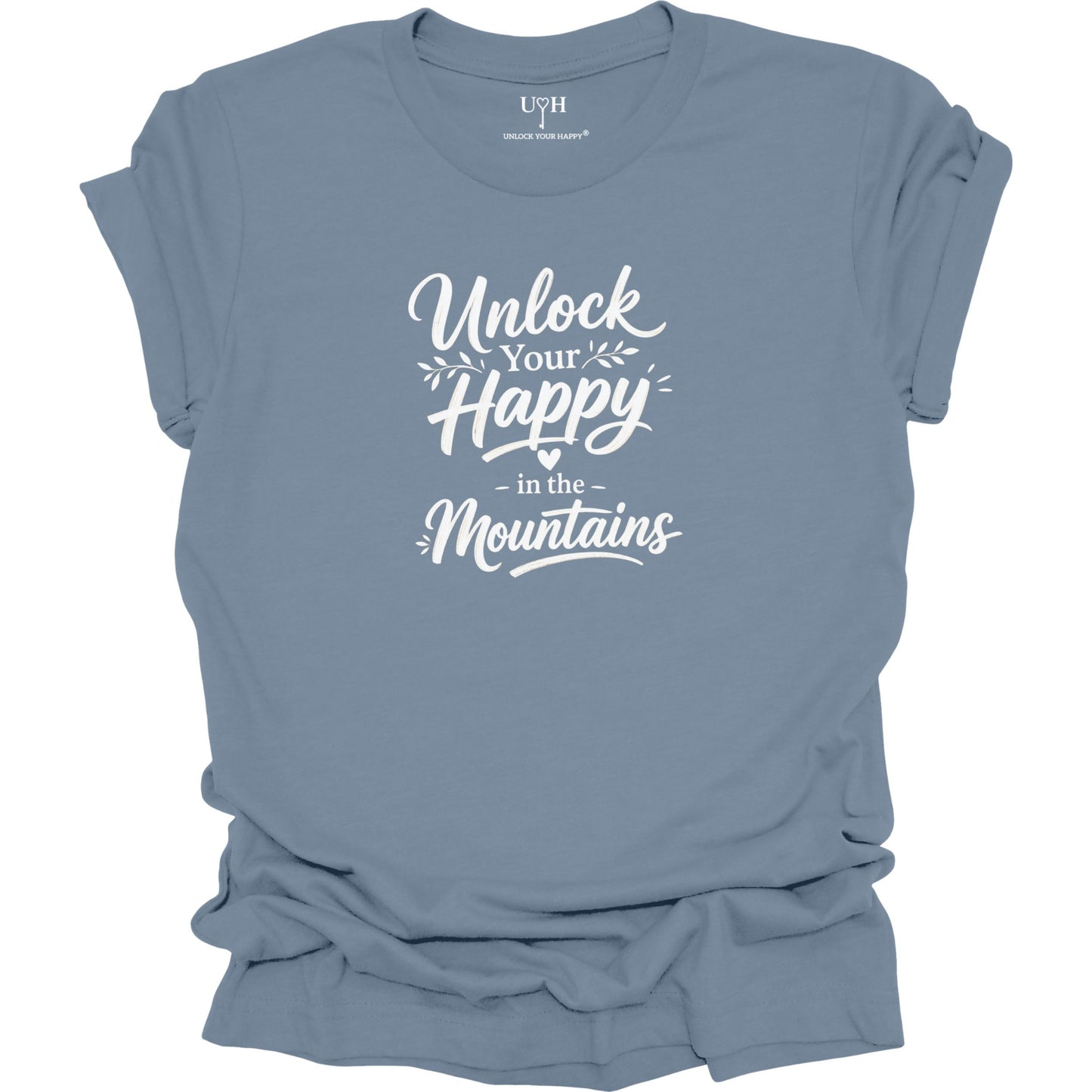 Blue t-shirt with 'Unlock Your Happy in the Mountains' text on a white background