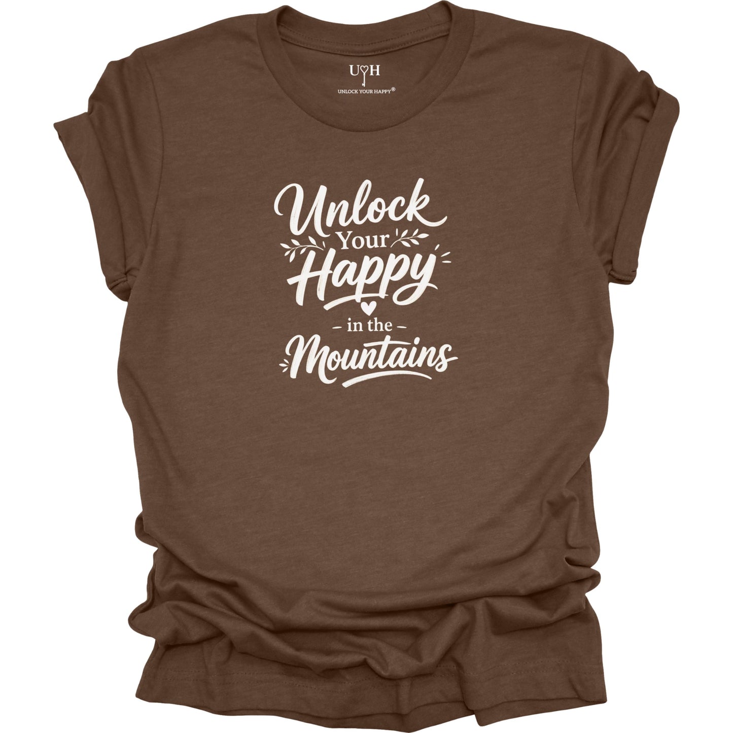 Brown t-shirt with white text 'Unlock Your Happy in the Mountains' on a white background