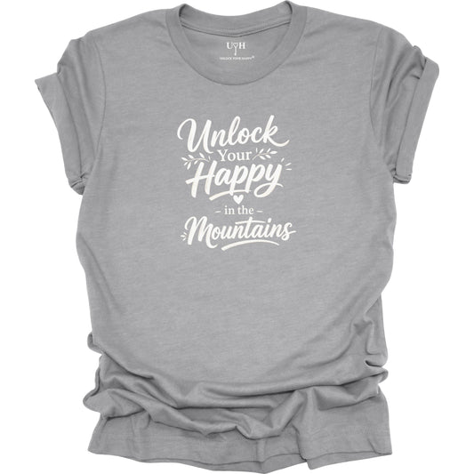 Gray t-shirt with mountain design and text 'I Heal in the Mountains' on a white background