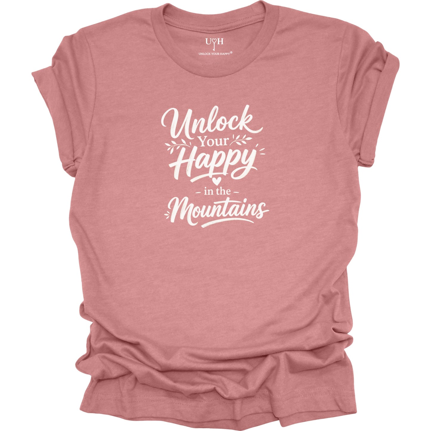 Mauve t-shirt with 'Unlock Your Happy in the Mountains' text on a white background