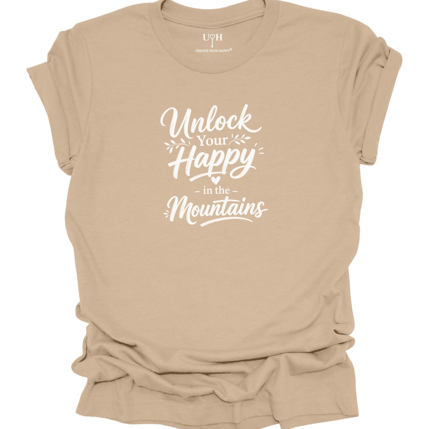 Tan t-shirt with 'Unlock Your Happy in the Mountains' text on a white background