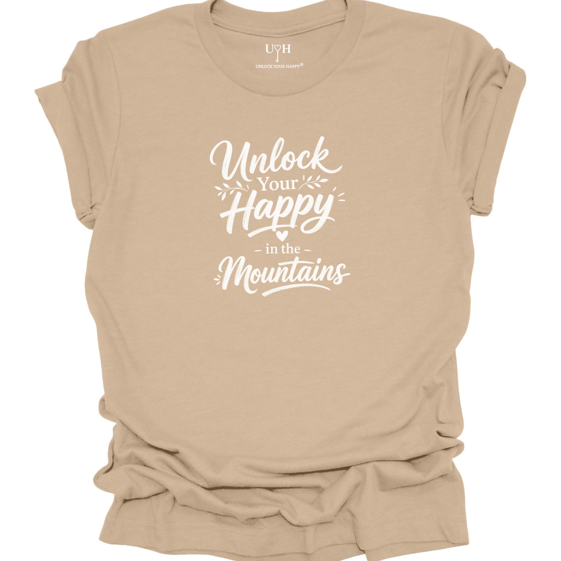 Tan t-shirt with 'Unlock Your Happy in the Mountains' text on a white background