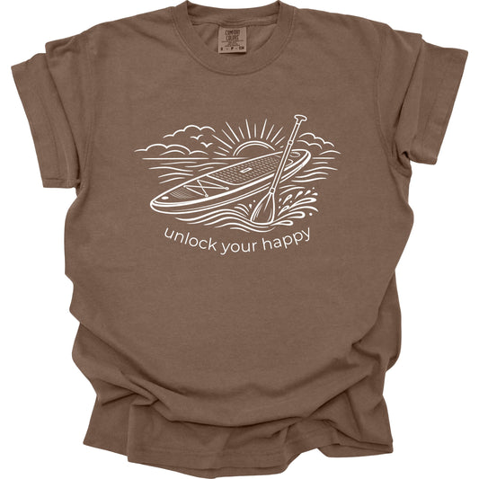 Brown t-shirt with paddleboard graphic and 'unlock your happy' text on a white background