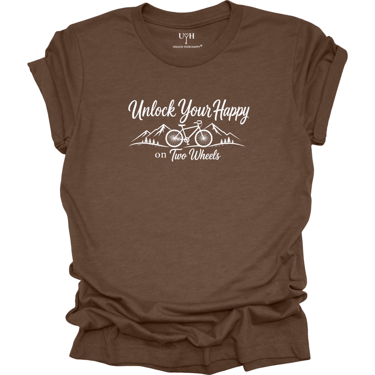 A brown short-sleeve t-shirt with a white graphic print that reads 'Unlock Your Happy on Two Wheels' above a bicycle and mountain illustration. The brand 'UYH' is visible inside the collar.