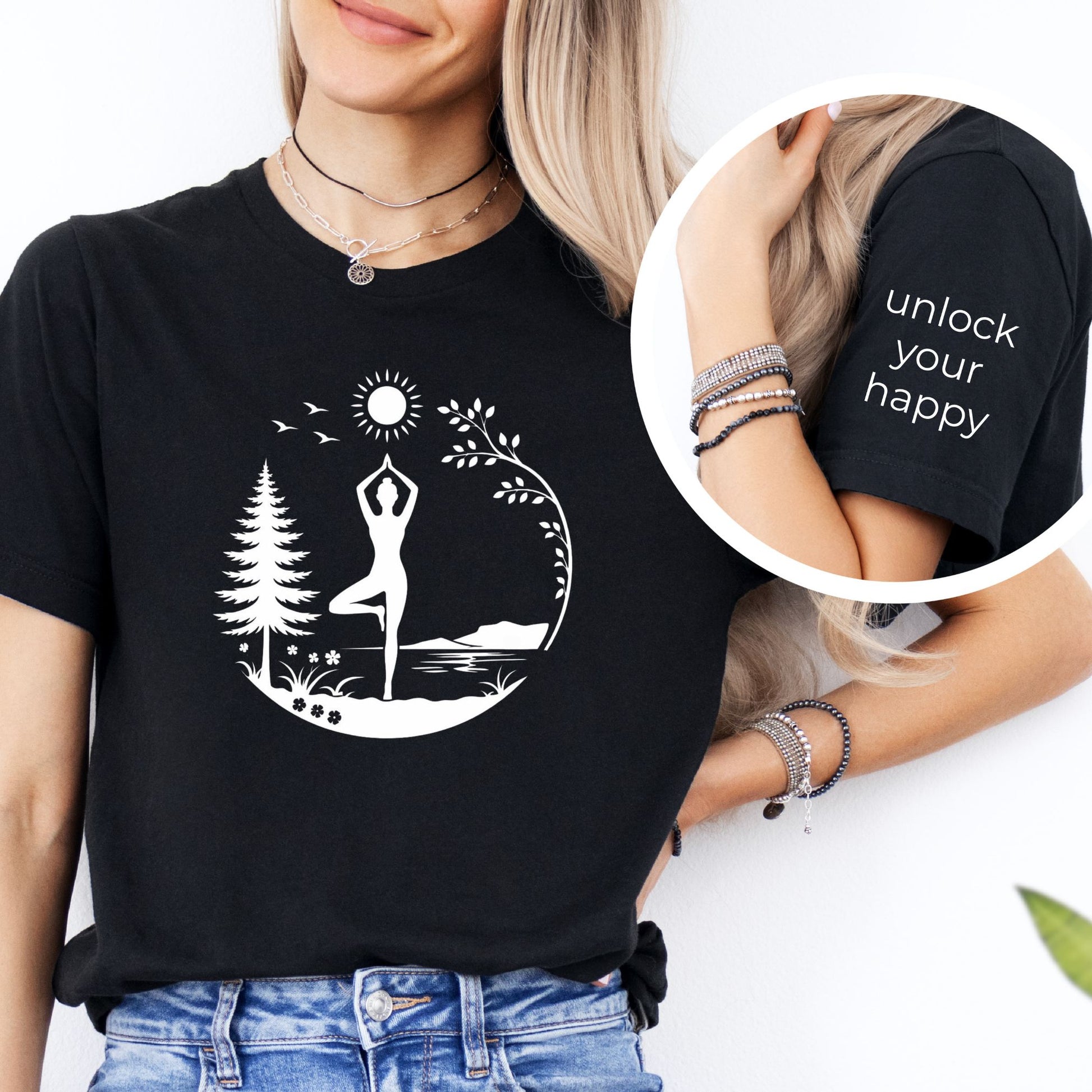 Person wearing a black t-shirt with a yoga design and sleeve text 'unlock your happy'.